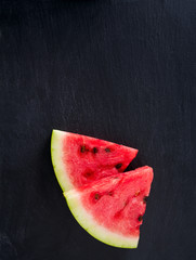 Fototapeta na wymiar freshly cut water melon on chalkboard