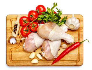 Raw chicken legs on a white background