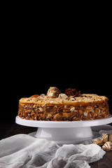 Cake Napoleon,puff cake decotrated with gauze and candies.Black