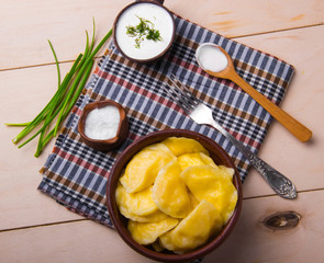 Vareniks  with sour cream and dill - national ukrainian cuisine.