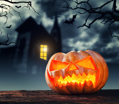 Scary halloween pumpkin with horror background