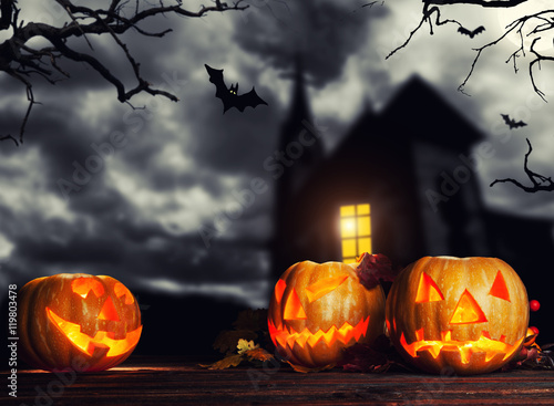 Scary halloween pumpkins with horror background