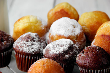 chocolate nad simple muffins very closeup with sugar powder.Selective focus