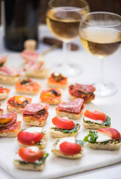 selection of antipasti tapas served with wine
