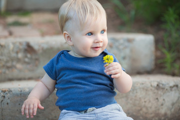 Happy cute boy on old roadway.