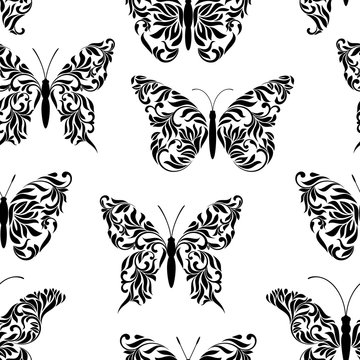 Seamless pattern with butterflies created from abstract floral tracery on a white background