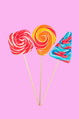 colorful lollipops candys on pastel background