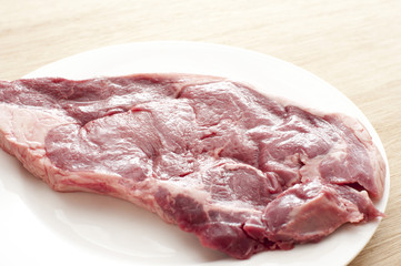 Close up Fresh Rump Steak on White Plate