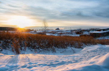 Winter sunset in the village, Russia, Ural