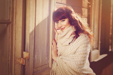 Beautiful girl outdoors near window