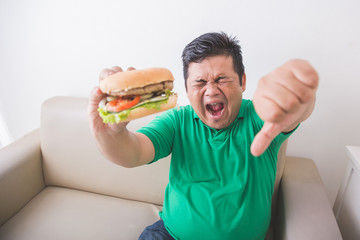 Overweight man stop eating junk food