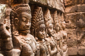 Fototapeta na wymiar Angkor Wat temple, wall ornaments, stone carvings