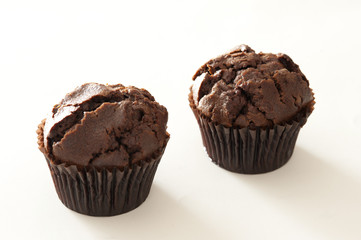 Pair of baked chocolate muffins