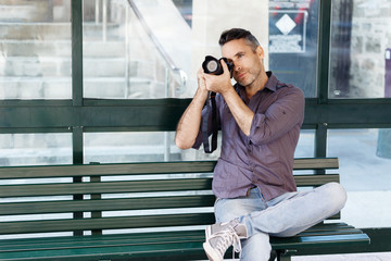 Male photographer taking picture