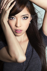 Fototapeta na wymiar portrait of beautiful young asian woman with flawless skin and perfect make-up