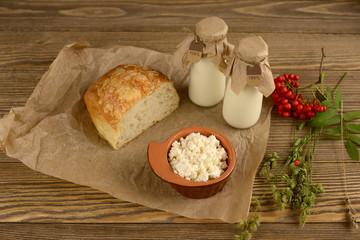 Natural dairy products in a rustic style on the wooden background
