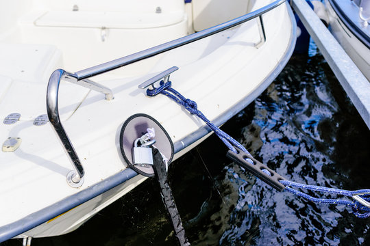 Padlock and covered chain secure the boat from random theft.