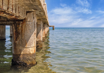 Dock concrete pillar on sea background