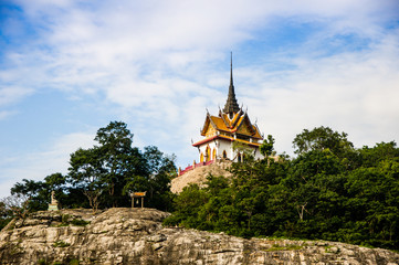 Fototapeta na wymiar Beautiful Temple on Hill and Cloudy Sky, Petchaburi, Thailand