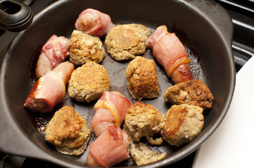 Overhead view of sausage wrapped in bacon