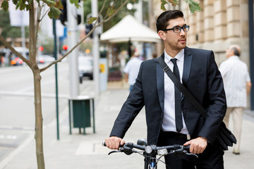 Young businessmen with a bike