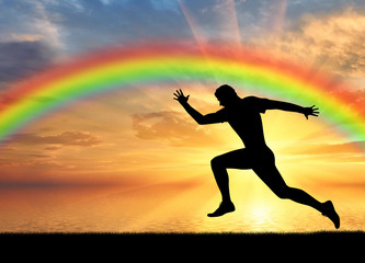 Fototapeta na wymiar Male runner at rainbow background