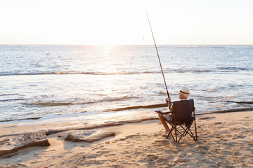 Fototapeta na wymiar Senior man fishing at sea side