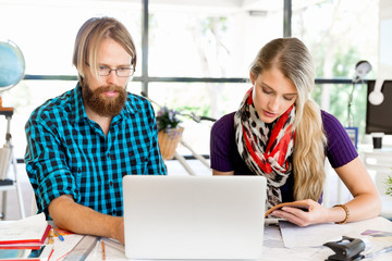 Two office workers at the desk