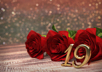 birthday concept with red roses on wooden desk. nineteenth. 19th. 3D render