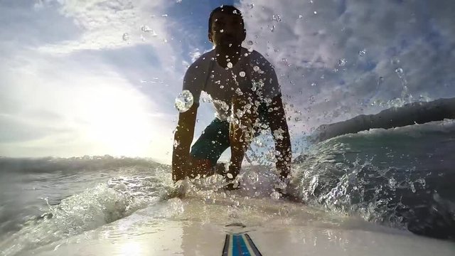 surfing at sunset in cinemagraph effect