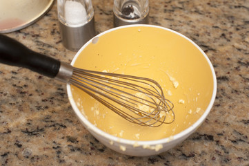Empty mixing bowl with remnants of batter