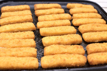 Freshly baked fish fingers