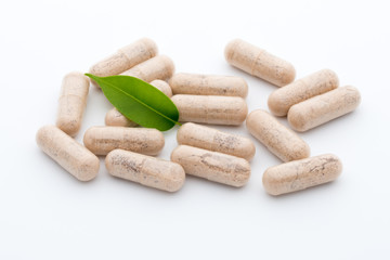 Ginkgo biloba capsule on the white background.