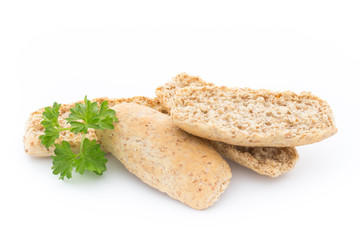 Dry flat bread crisps with herbs on a white background.