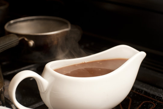 Gravy boat filled with delicious rich gravy