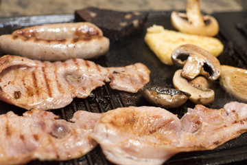 bacon breakfast cooking on a griddle
