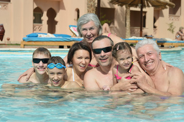 Family relax in  pool