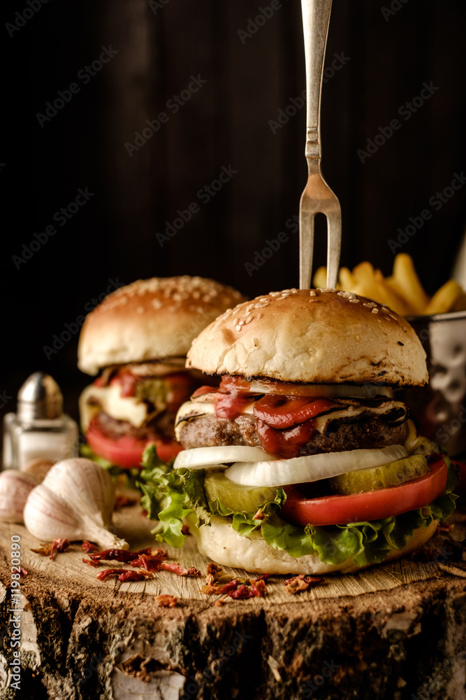 Wall mural Homemade hamburger with lettuce and cheese.