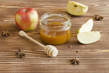 Honey jar and apples