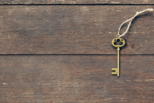 old key on wood background with copyspace.