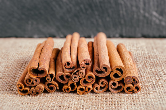 Cinnamon sticks on burlap fabric with faded effect