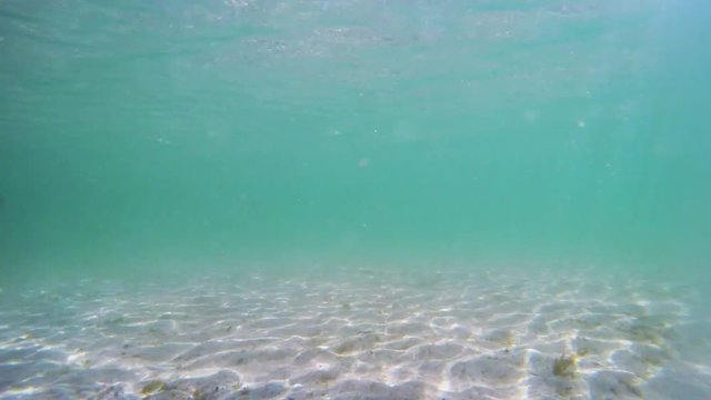 rocks and sand underwater in Sardinia 