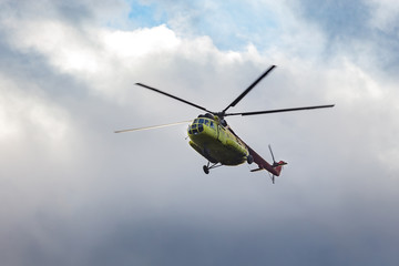 Fototapeta na wymiar green helicopter in flight