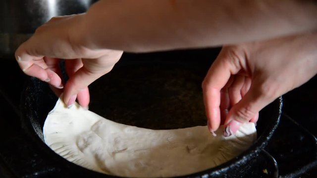 Housewife roasts chebureks - Georgian national dish