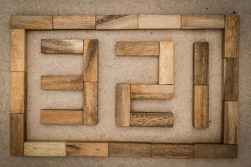 a wooden graph with pattern block/ business concepts