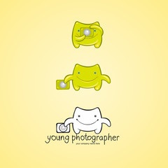 Cute green monster photographer character with camera
