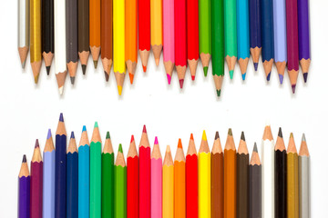 Row of color pencil on white background