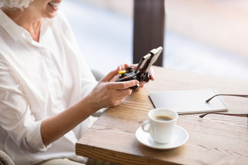 Positive woman resting at the table