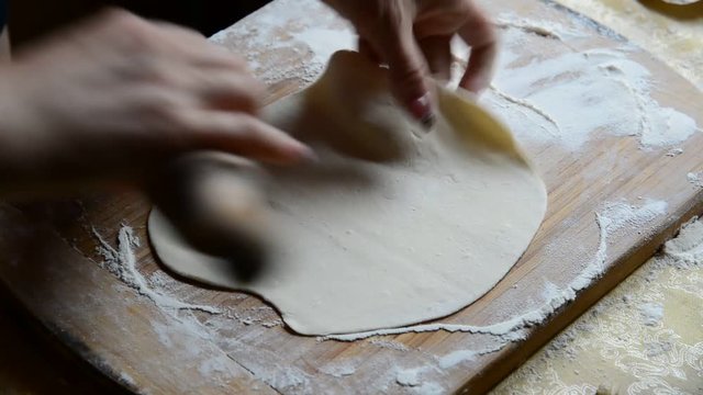 Housewife making chebureks - Georgian national dish