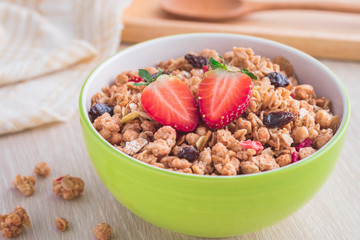 Muesli with strawberry in bowl for healthy breakfast